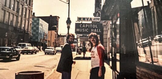 Two guys on a street.