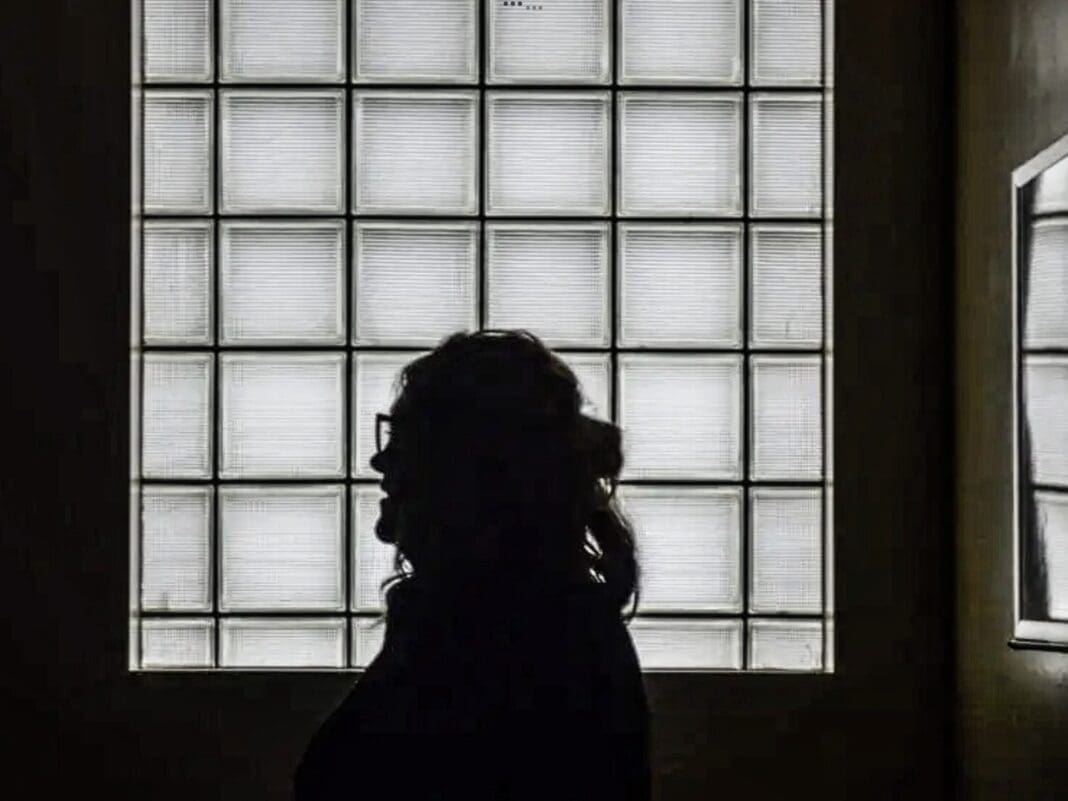 A silhouette in a window.