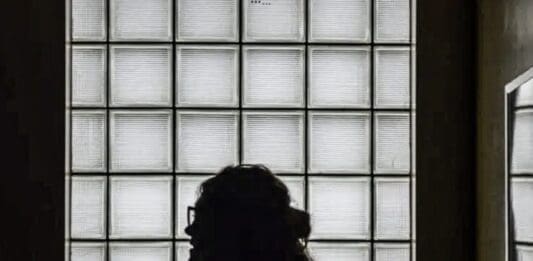 A silhouette in a window.