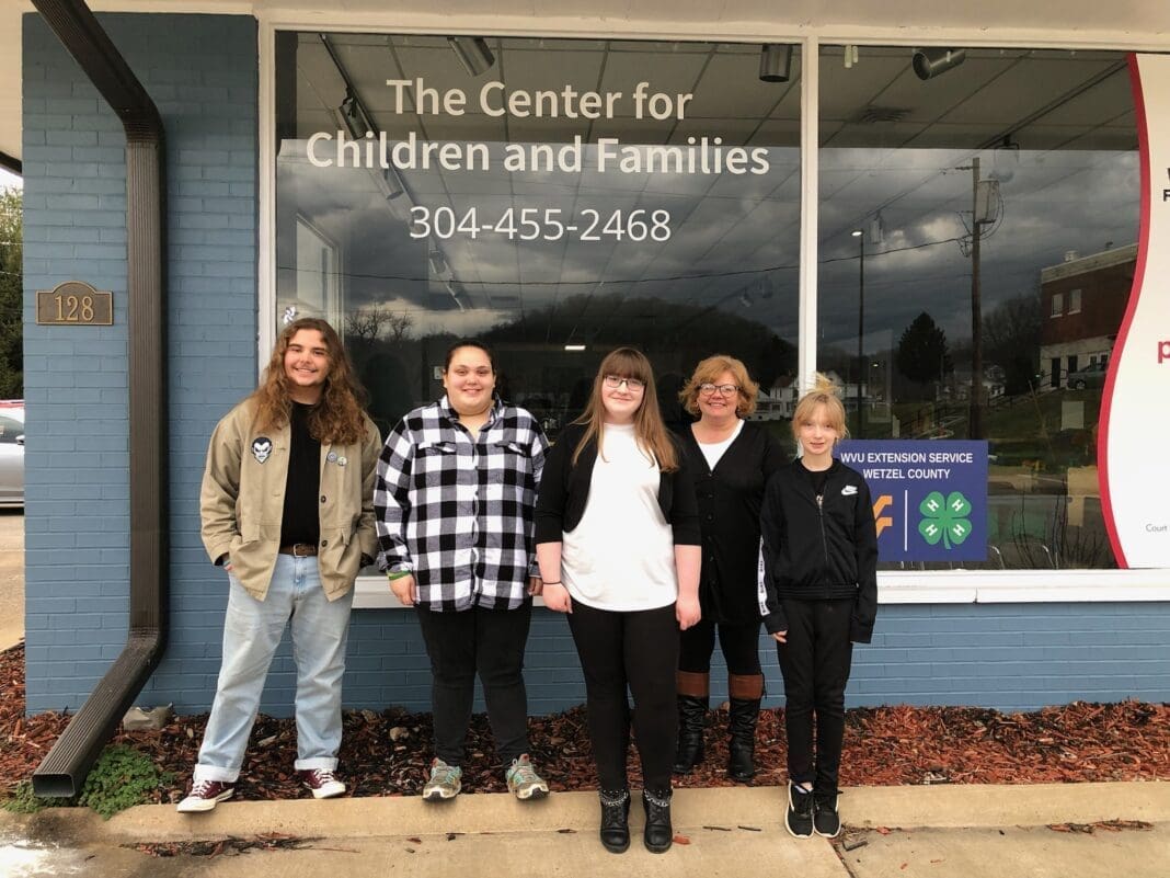 Four students and a teacher.