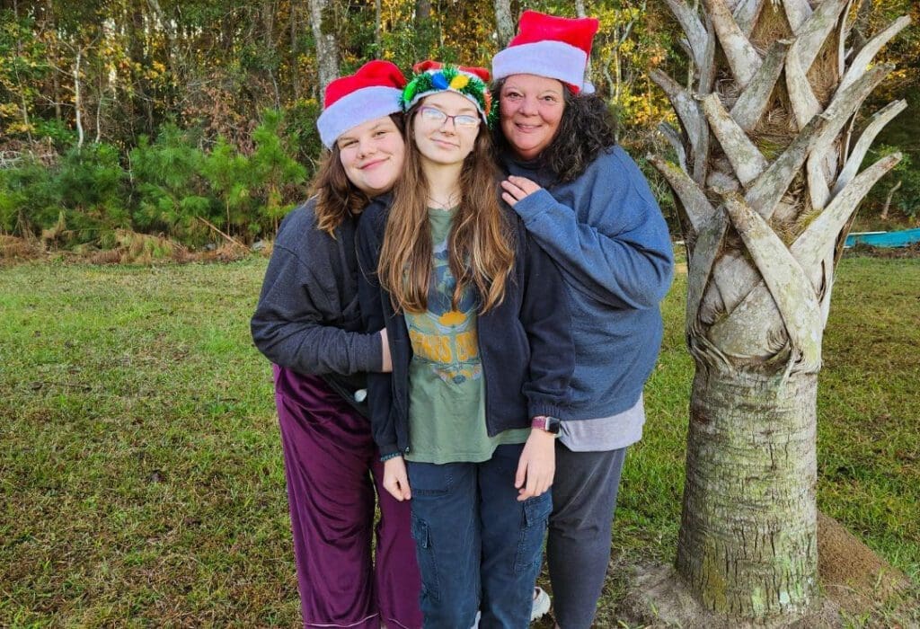 A mom and her daughters.