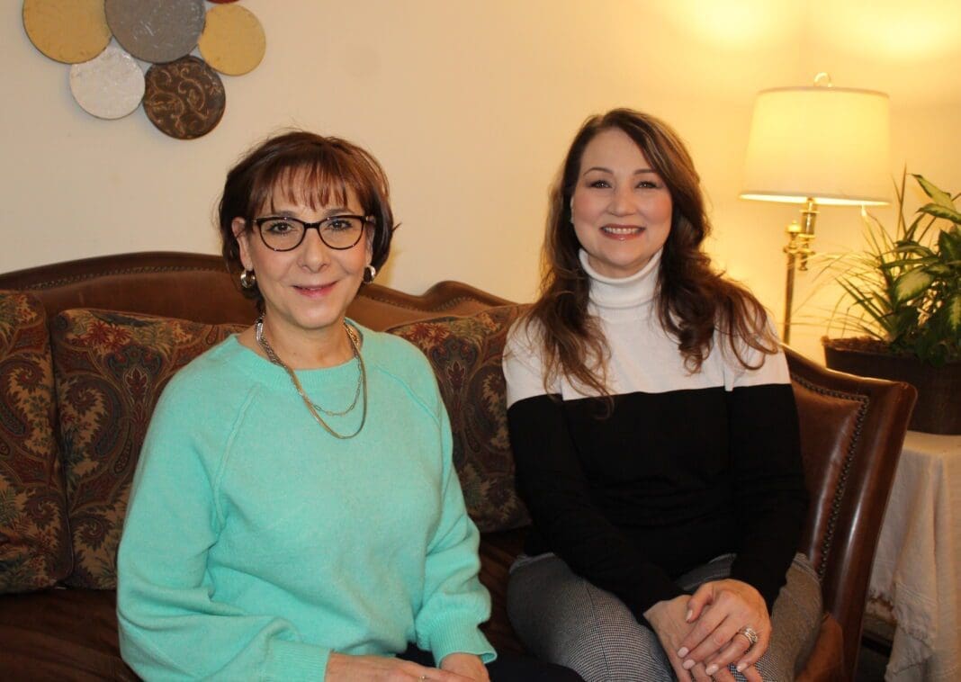 Two women sitting together.