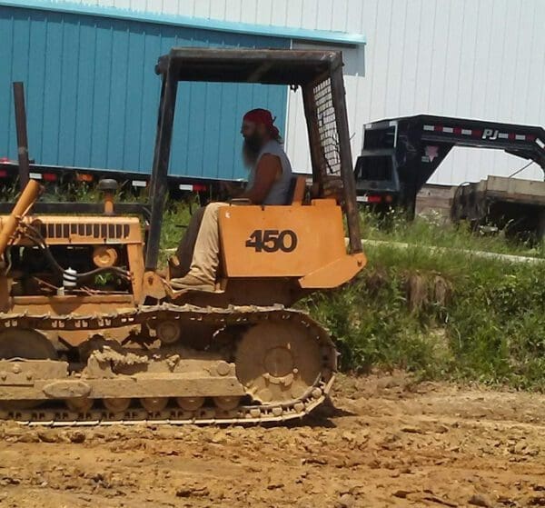 A man on a tractor.