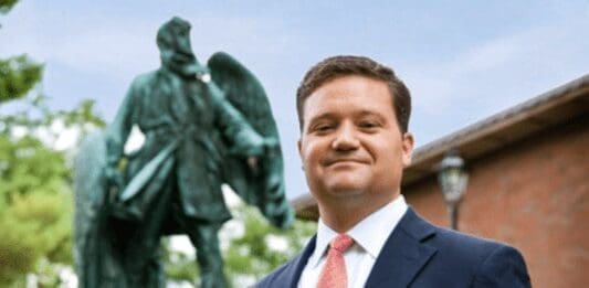 A man near a statue.