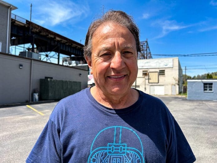 A man in a parking lot.