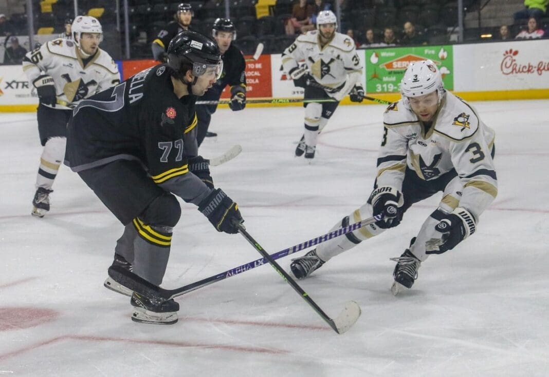 Teams playing hockey.