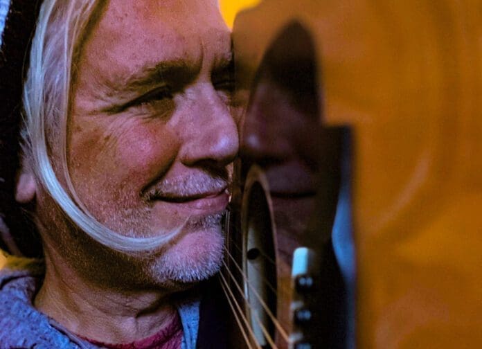 A man with a guitar.