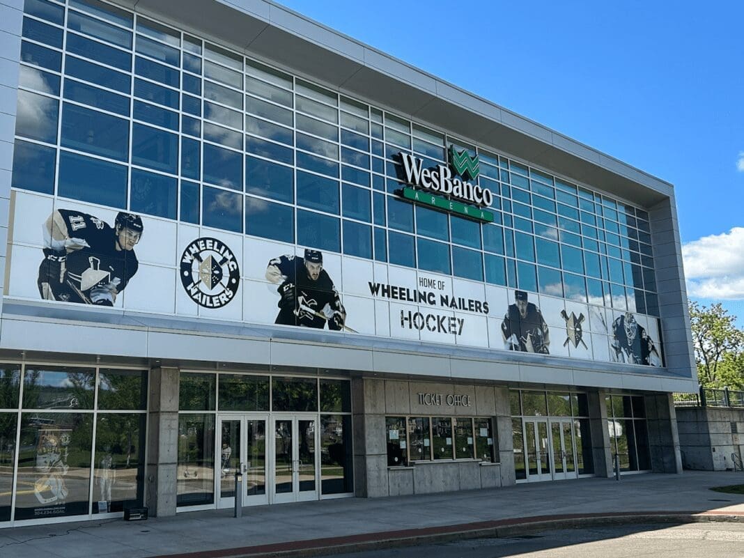 An arena with a blue sky.