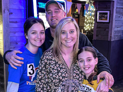 A family posing for a photo.