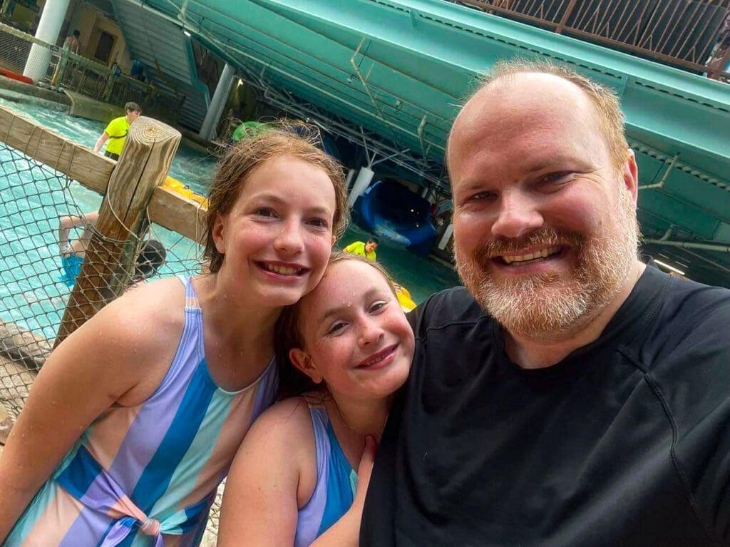 A man with two girls.