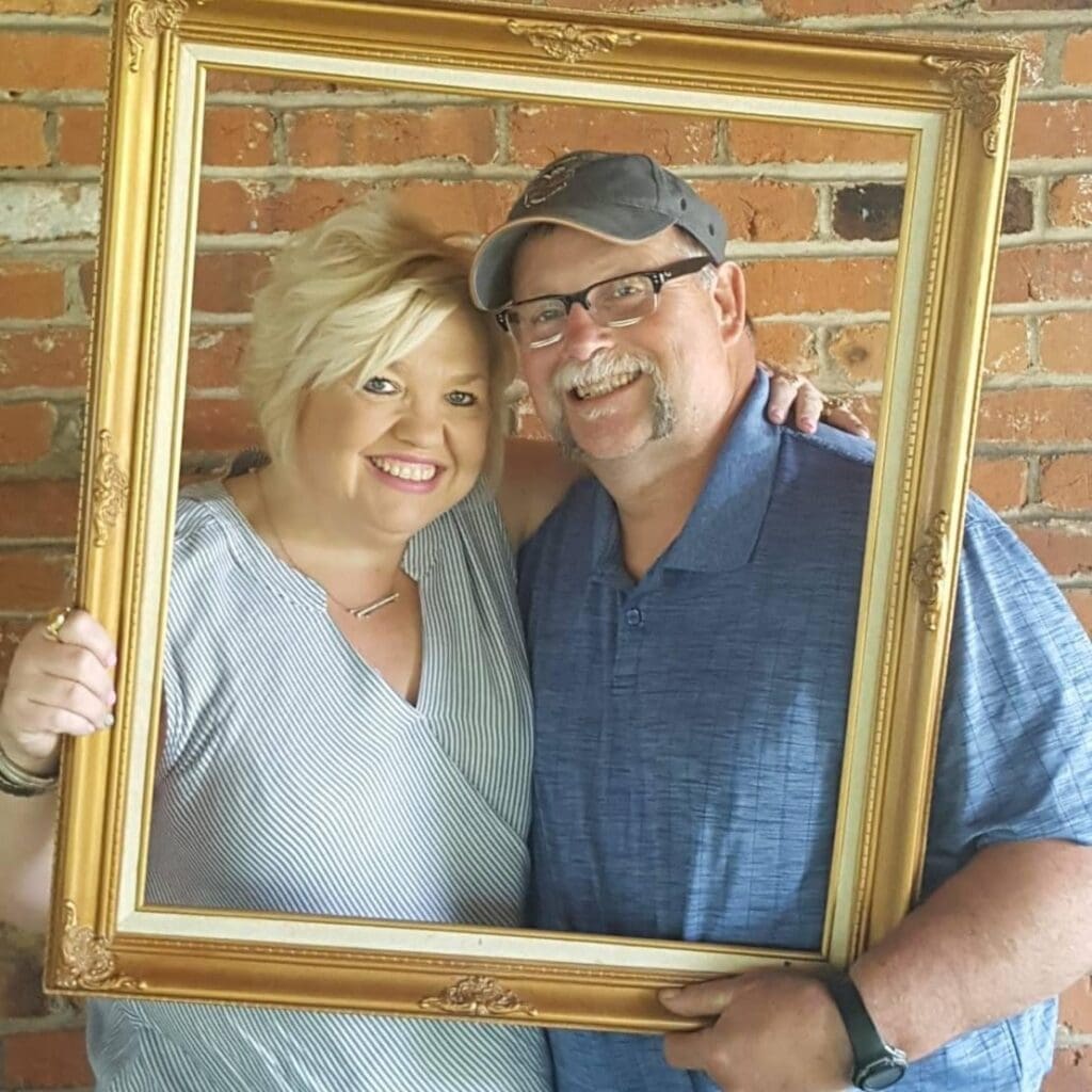 A man and woman in a frame.