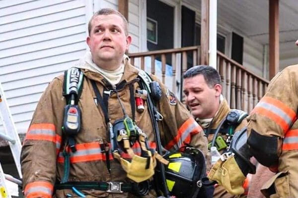 A man in firefighter's gear.