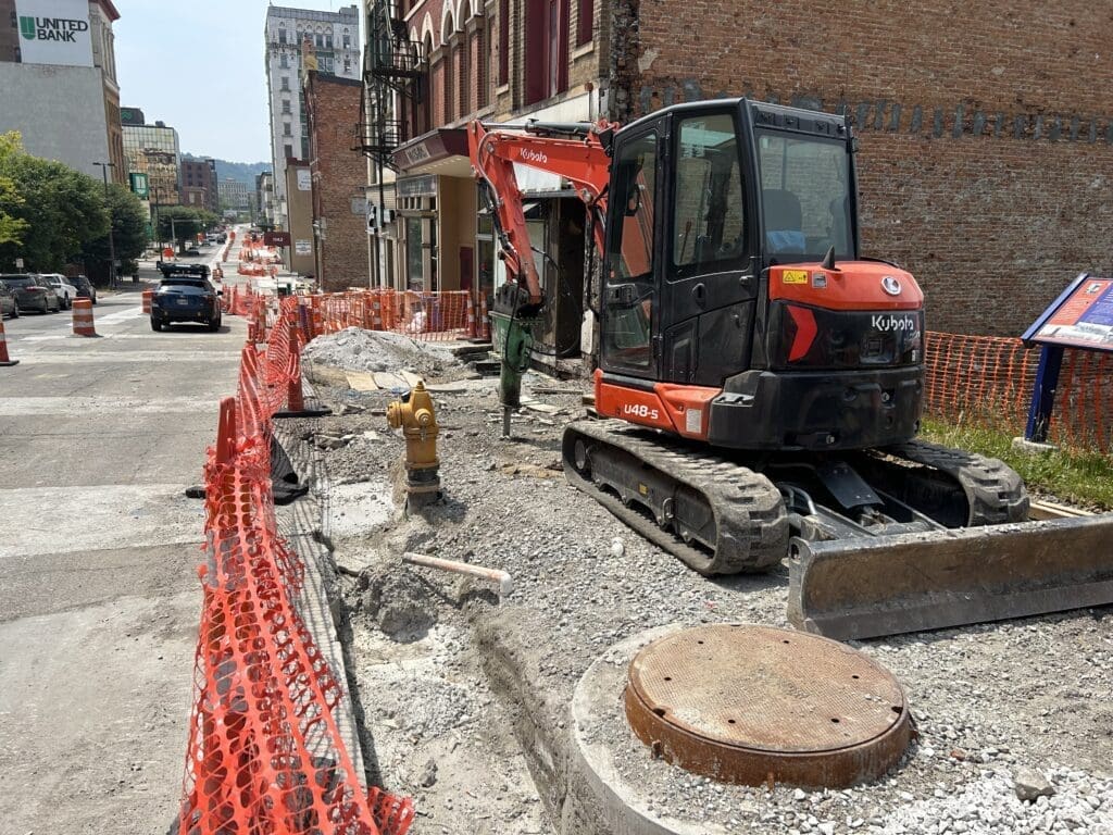 A crusher on a sidewalk.