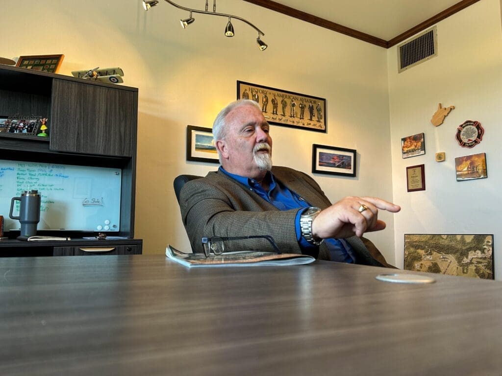 A man at a desk.