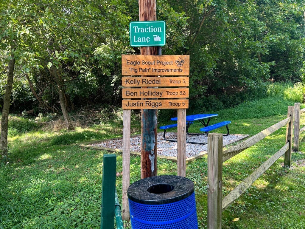 A sign near a path.