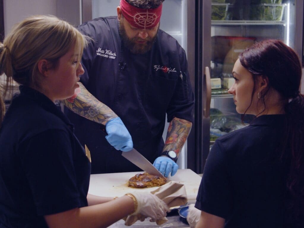 A chef and two servers.