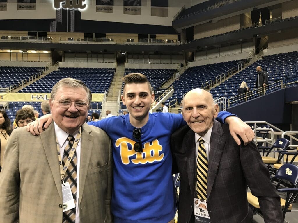 Three men posing.