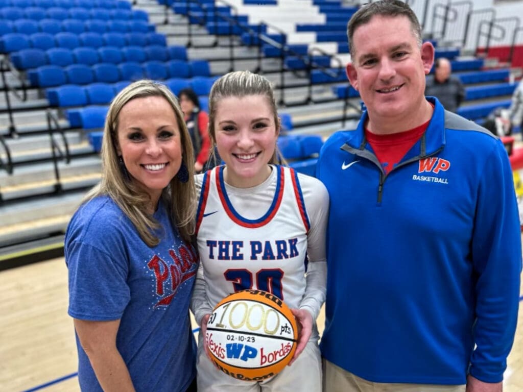 A mother and father with a daughter.