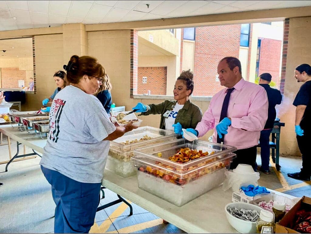 A man serving food.