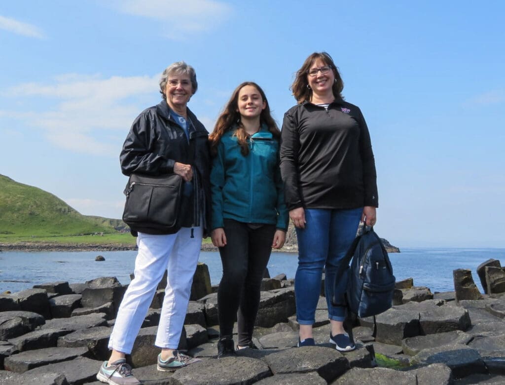 Three ladies on a rock.