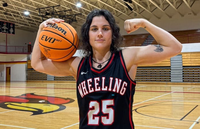 A woman holding a basketball.