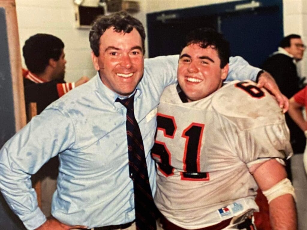 A coach and his son.