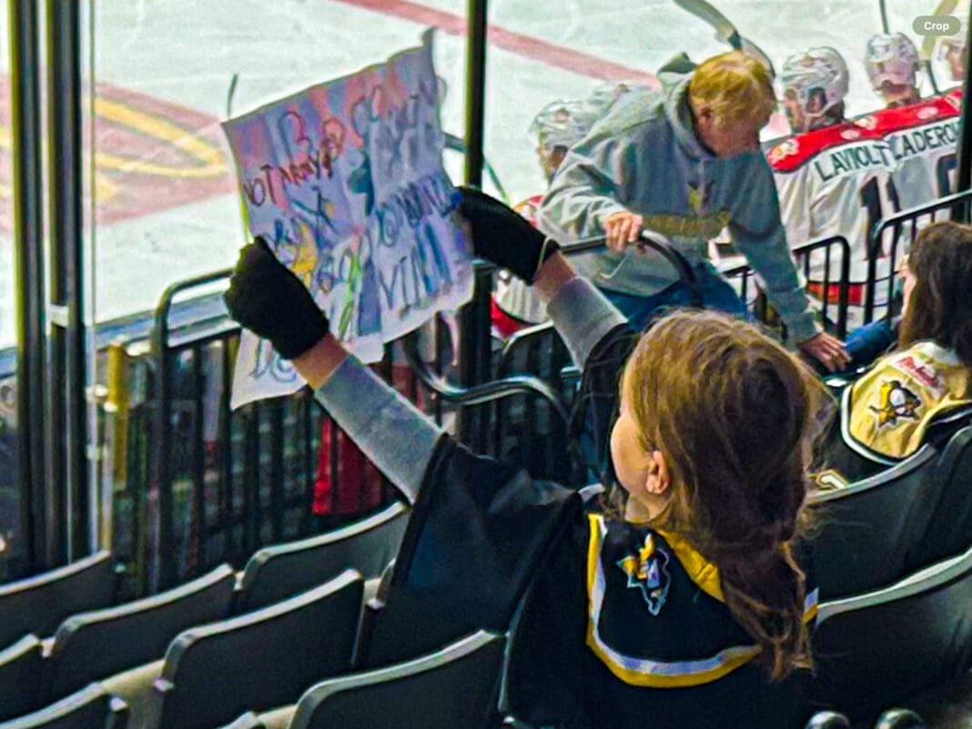 A kid with a sign.