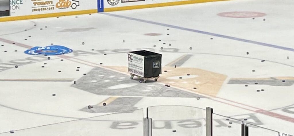 A laundry basket in the midd;le of a rink.