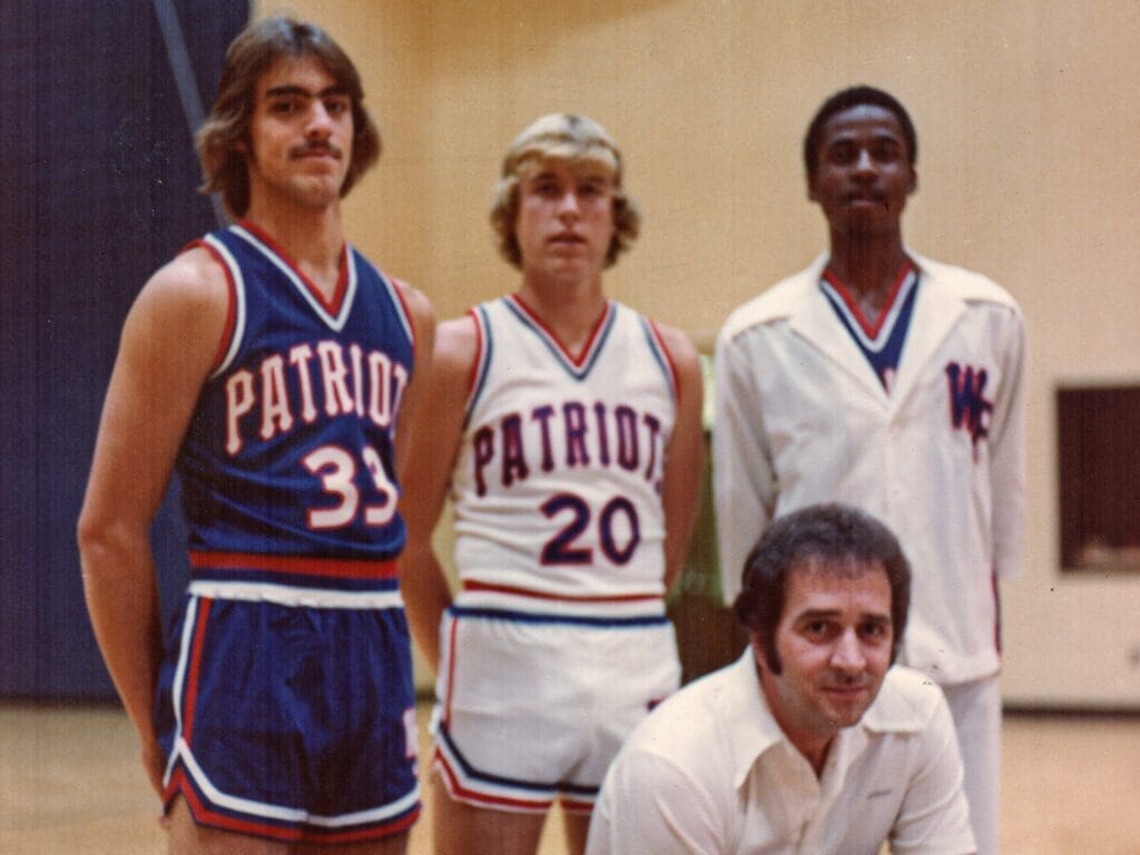 A coach with players.