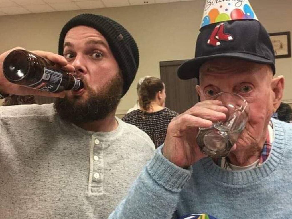 Two men drinking.