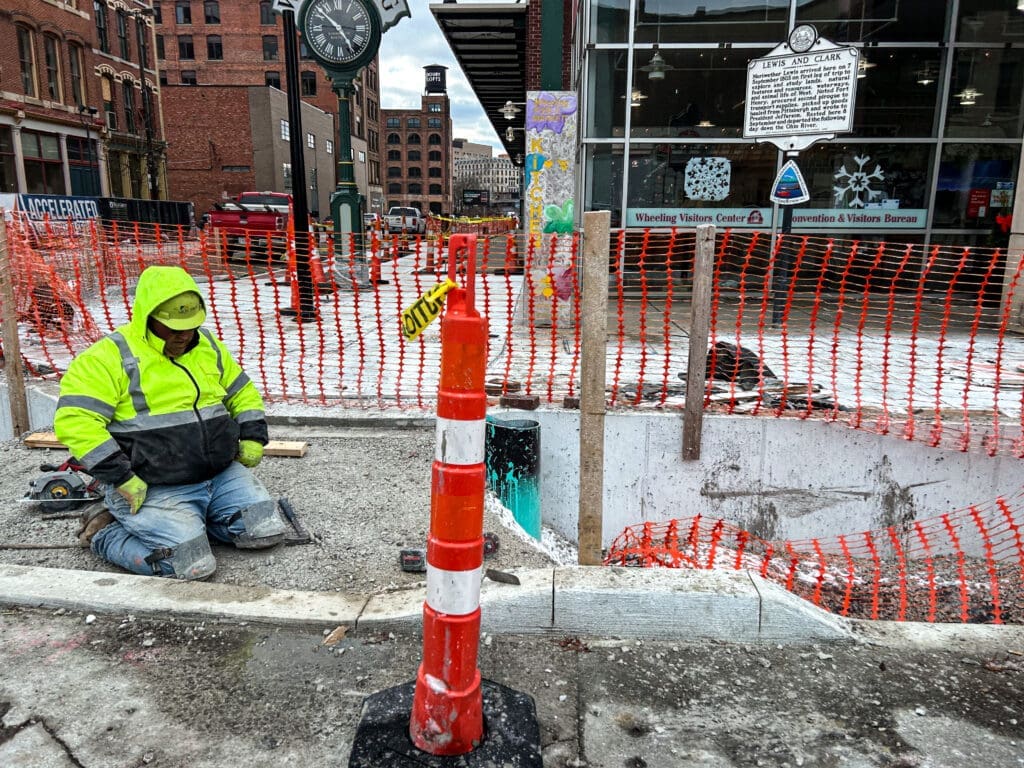 A street employee on his knees.