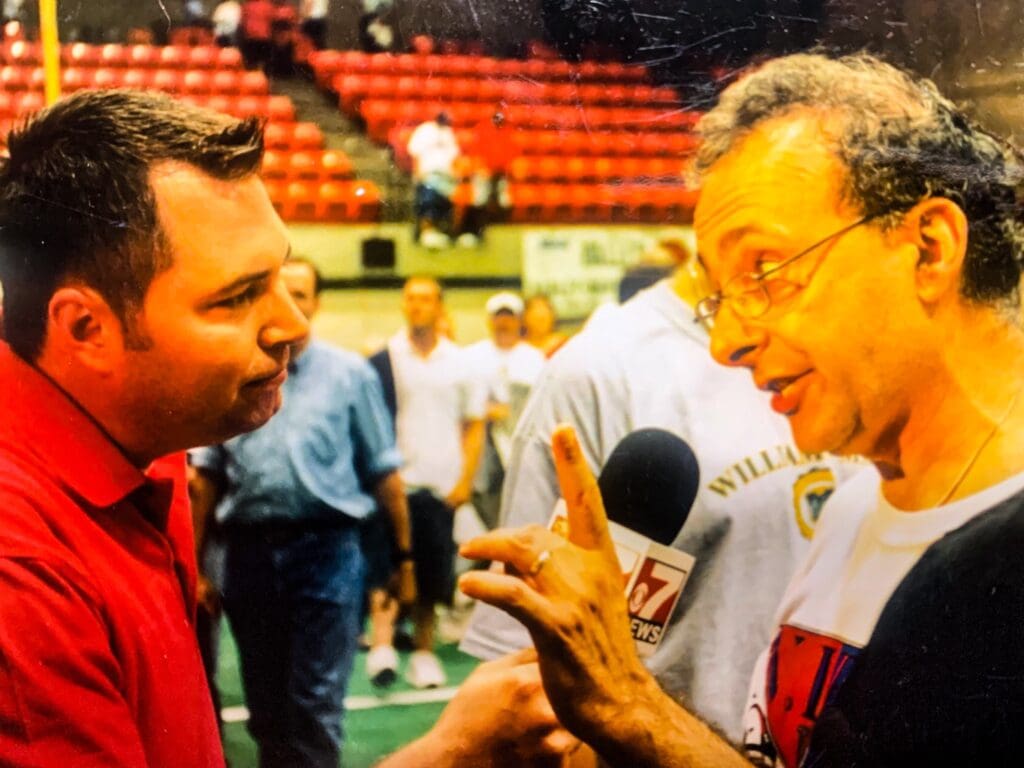 A reporter interviewing.