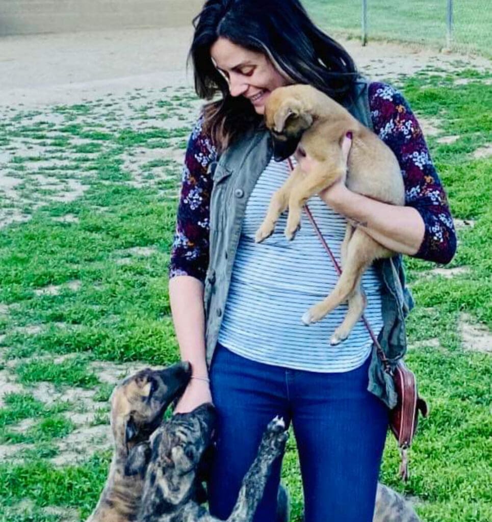 A woman with dogs.