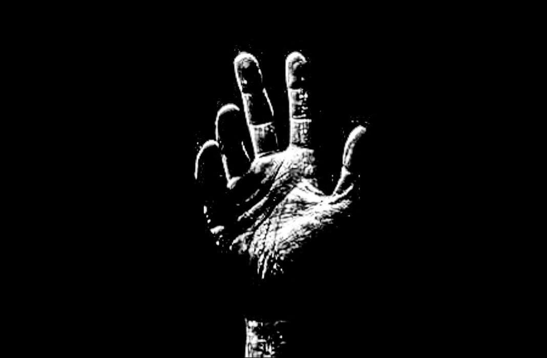 A hand in the dark.