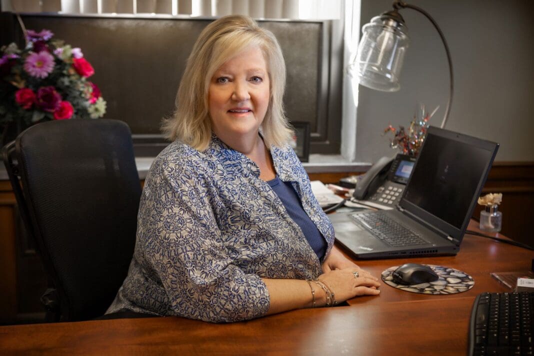 A lady at a desk.