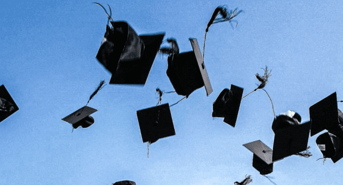 6C8038FC-56B3-4E14-B85D-C5710B597CA8 A cap and gown.