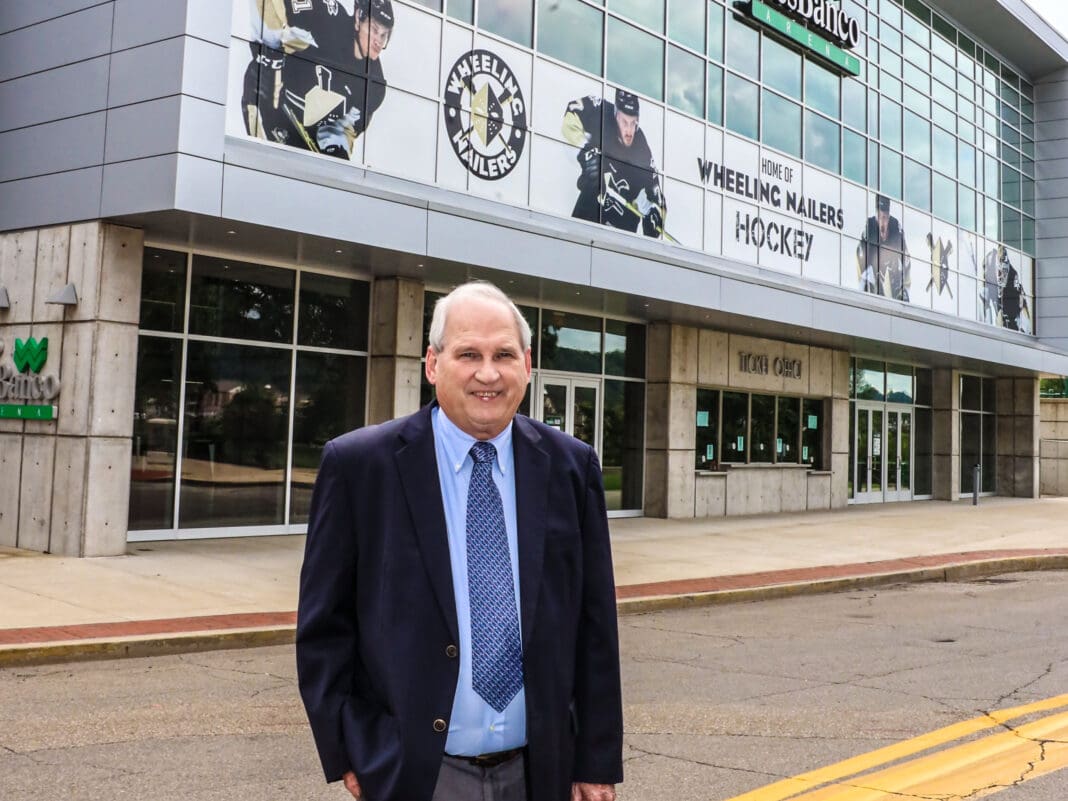 A man in front of a building.