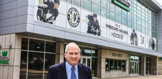 A man in front of a building.