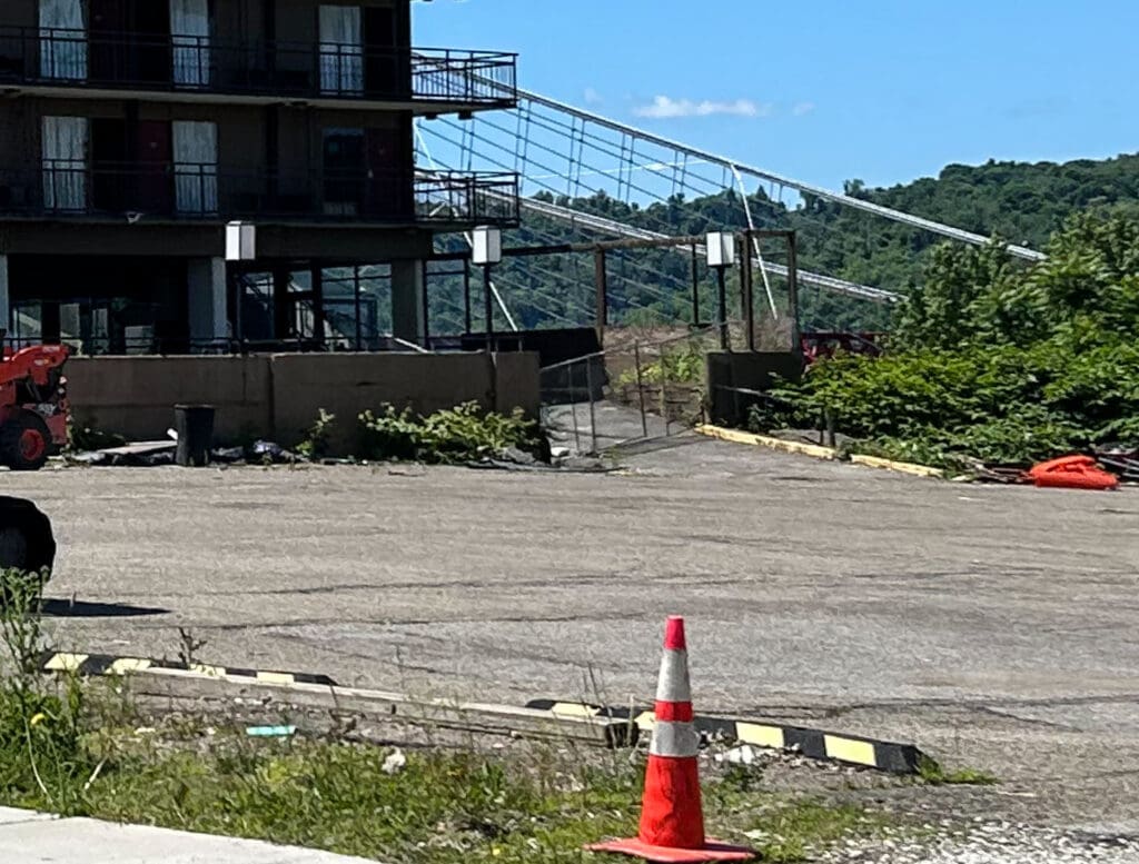 A bridge behind a building.