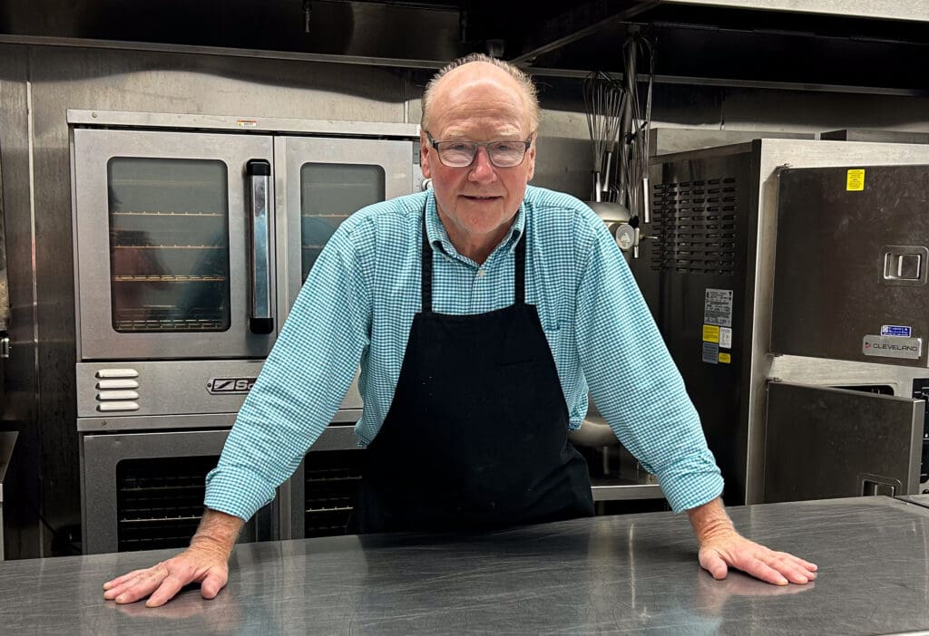 A man in a kitchen.