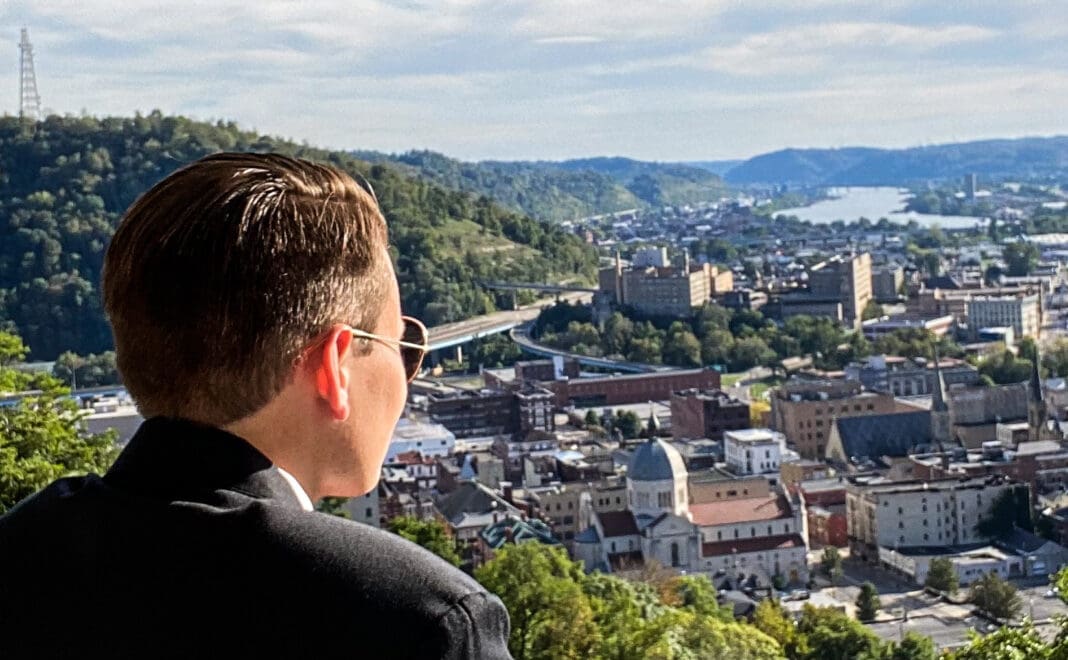 WS man looking over a town.