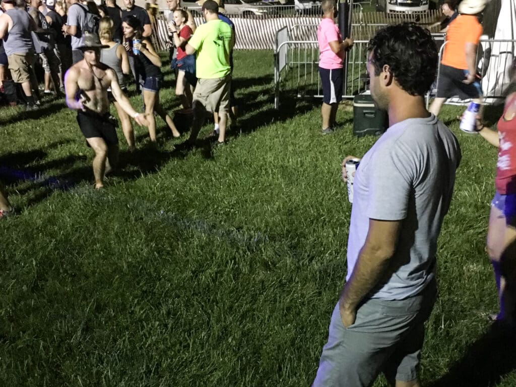 A man holding a beer.