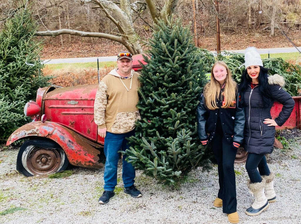 Creely family with Christmas tree.