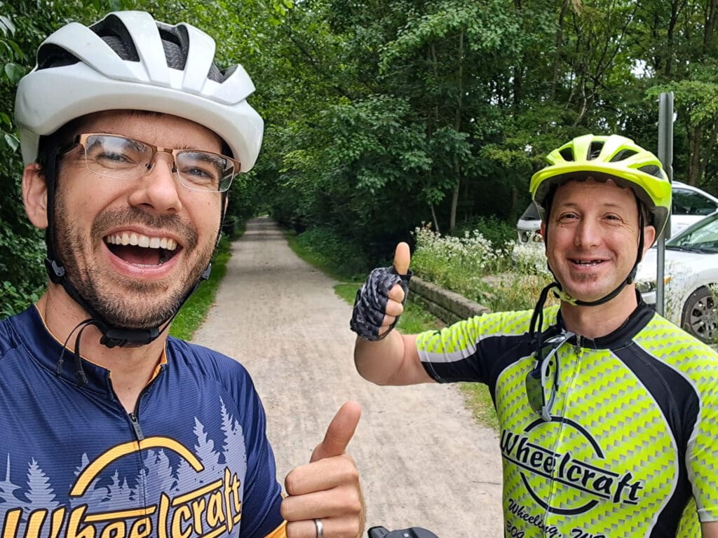 Two men on bikes. 