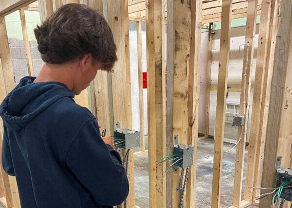 A kid doing carpentry.