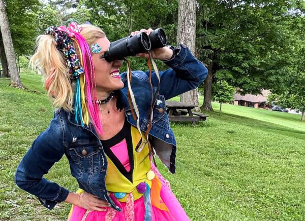 A lady with binoculars.