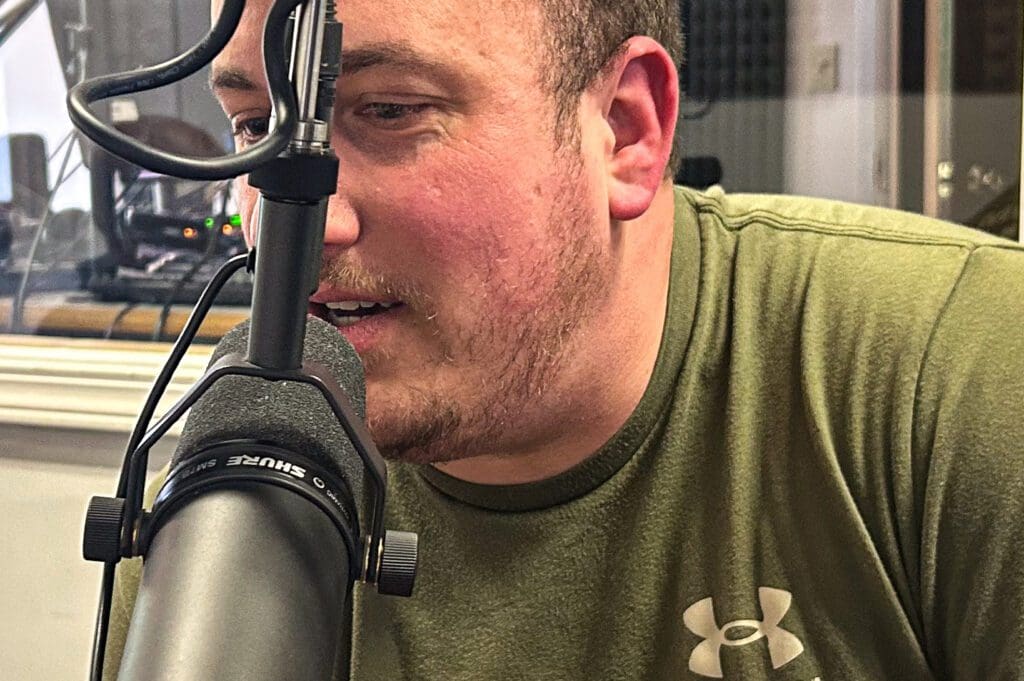 A man at a microphone.