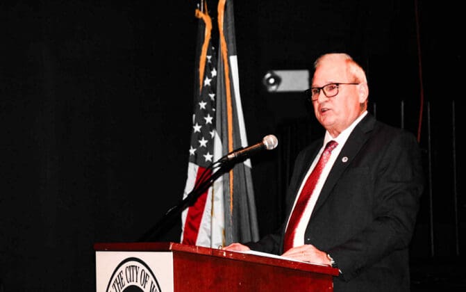 A man at a microphone.