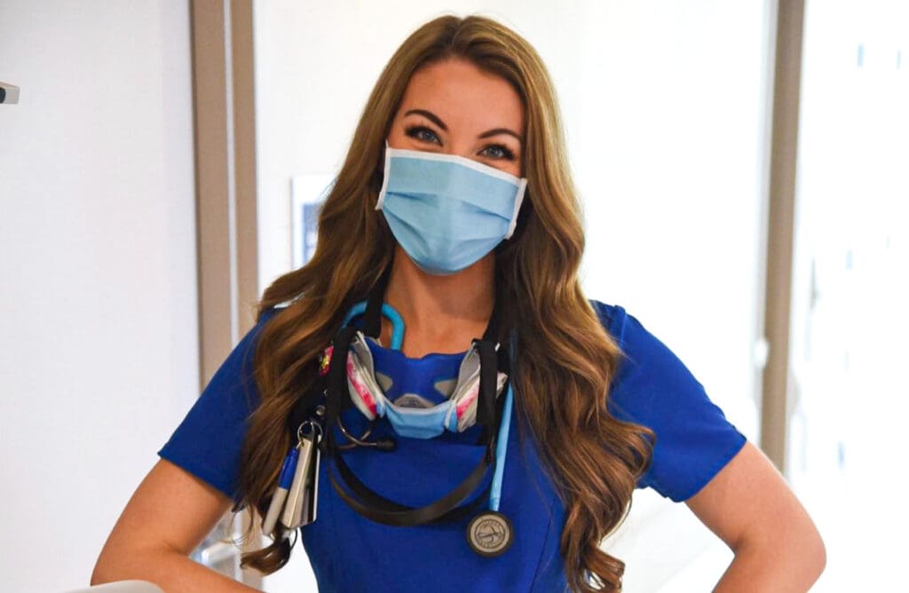 A female wearing a mask.