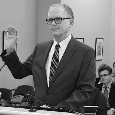 A man takin an oath.